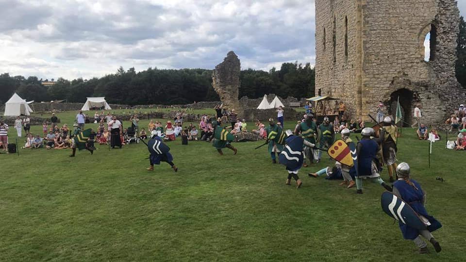 A battle rages at a ruined castle